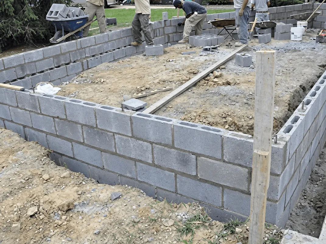 Professionals building a foundation with blocks in Buffalo, NY