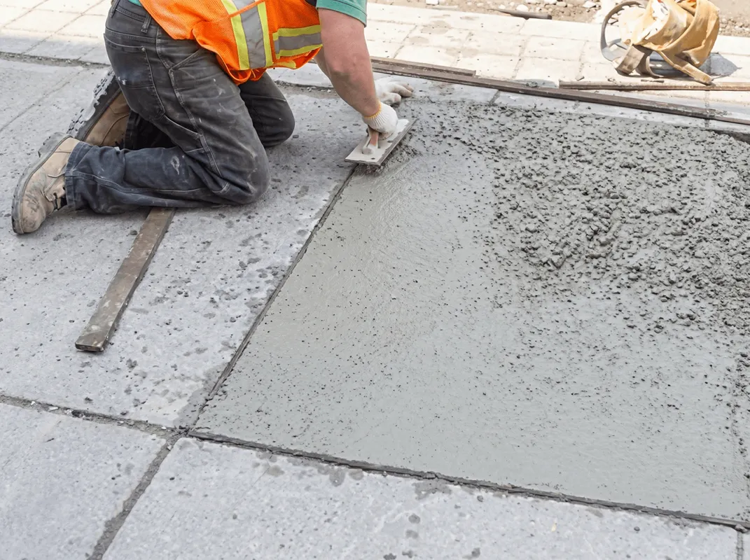 Professional repairing a concrete floor in Buffalo, NY